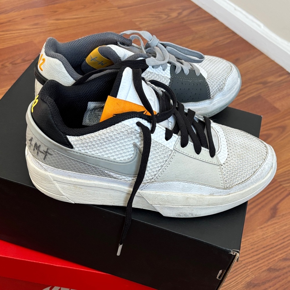 Nike Men's 6 Y or Woman’s 8 White and Black Sneakers with Orange Accents